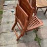 Four foldable garden chairs, one table and a parasol Image 2