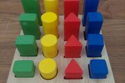 Wooden shape sorting and stacking board