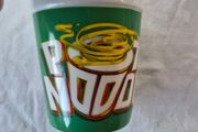 A ceramic novelty Pot Noodle container.