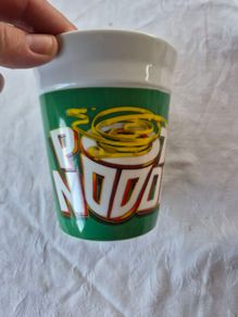 A ceramic novelty Pot Noodle container.
