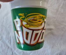 A ceramic novelty Pot Noodle container.