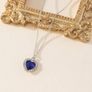 Heart Shaped Necklace with a Blue Stone Image 4