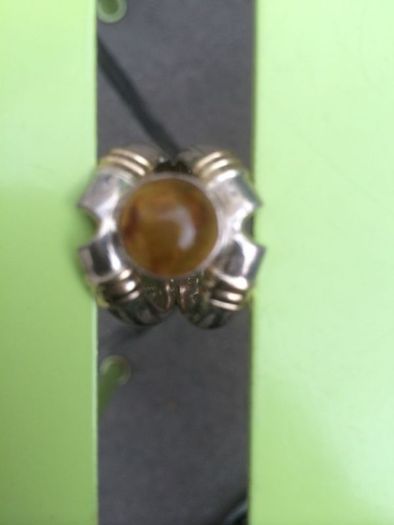A lovely silver and gold ring with Amber stone