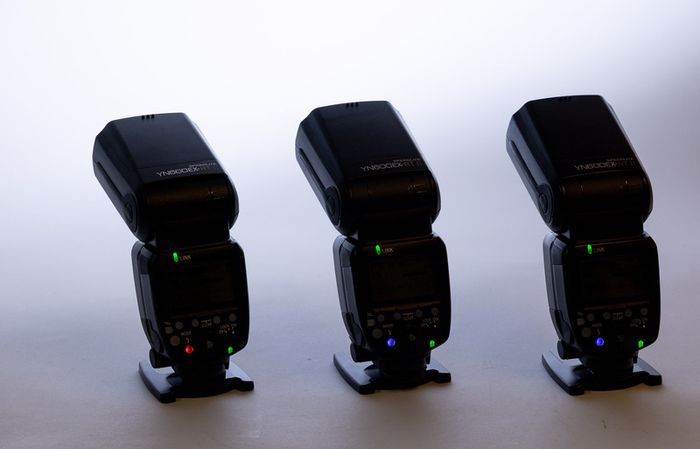 Three Yongnuo YN600EX-RT II flashguns with bag and accessories