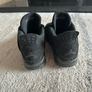 Black Cat Jordan 4s Image 4