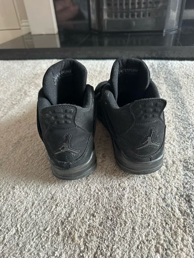 Black Cat Jordan 4s