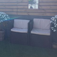 2 rattan chairs and 2 coffee tables