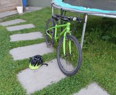 Green kids Frog bike with helmet