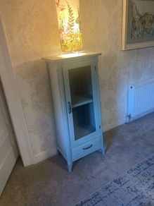 Sage green display cabinet