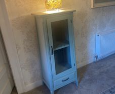 Sage green display cabinet