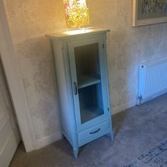 Sage green display cabinet
