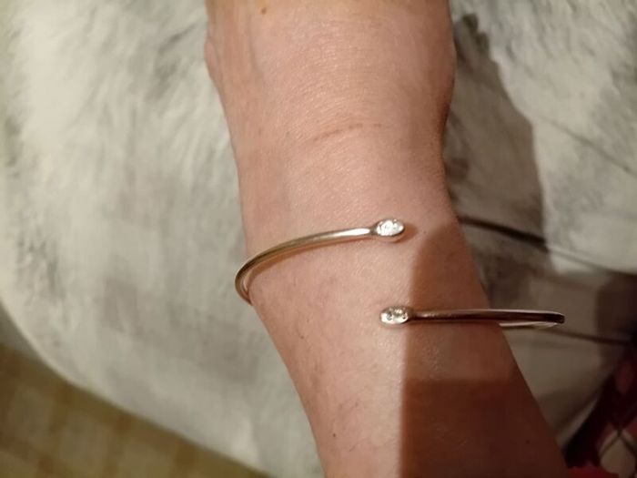 Silver tone adjustable bracelet with charms