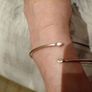 Silver tone adjustable bracelet with charms Image 5
