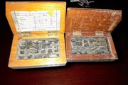 Antique printing equipment in wooden boxes