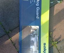 Dog car guard. Not used, just been in packaging in shed so looks old.