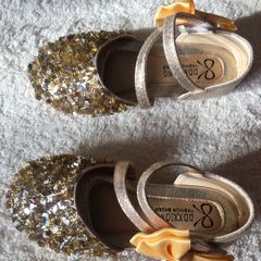 . Brand new in box , pair of girls gold shoes