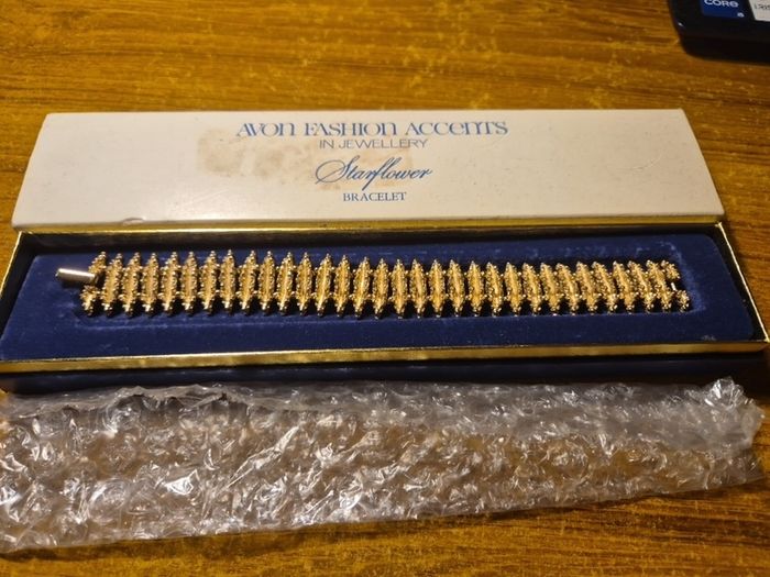 Rare Find. 1960s Avon Starflower gold plated bracelet in original box.