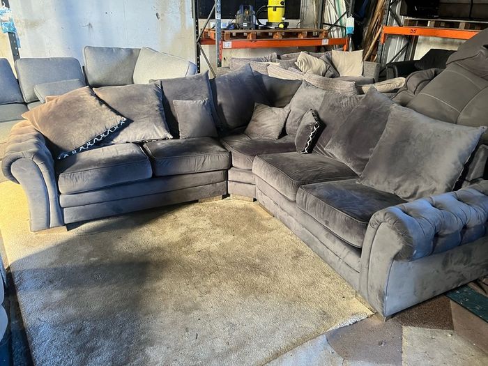 Grey corner sofa with scatter cushions