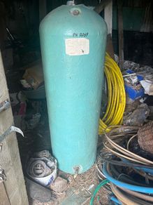 Hot water cylinder with immersion