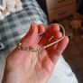 Silver toned bracelet with a heart shaped charm Image 3