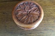 Wooden circular box with carved leaf pattern