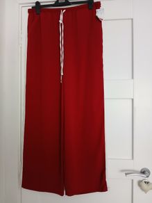 Red trousers (scarlet/maroon red) with white side stripe, size 14, regular leg length, new with tag