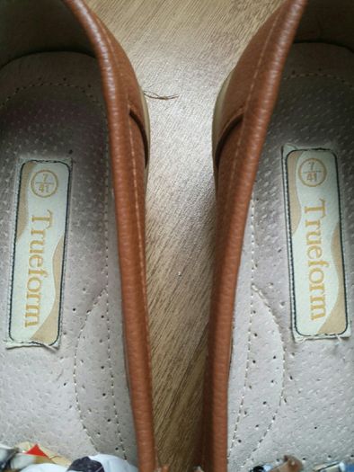 Beige coloured.