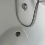 free standing bath with taps and and hose Image 3