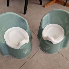 Two baby bjorn potties