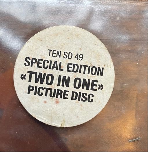 Rare and collectible Gary Moore and Phil Lynott special 2 in 1 shaped picture disc. Out in the fields and military man. Bought this new back in the day. Records were never played but picture disc discoloured over time as all versions did. Still highly col