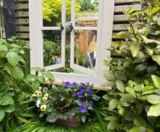 Garden reflection mirror window