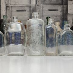 294 - Set of 7 Vintage Clear Glass Decorative Collectible Display Household Bottles