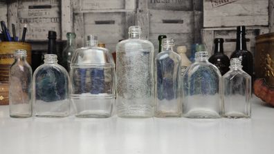 294 - Set of 7 Vintage Clear Glass Decorative Collectible Display Household Bottles