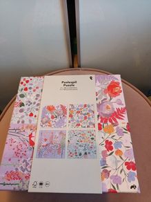 4 jigsaw puzzles on decorative box