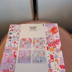 4 jigsaw puzzles on decorative box