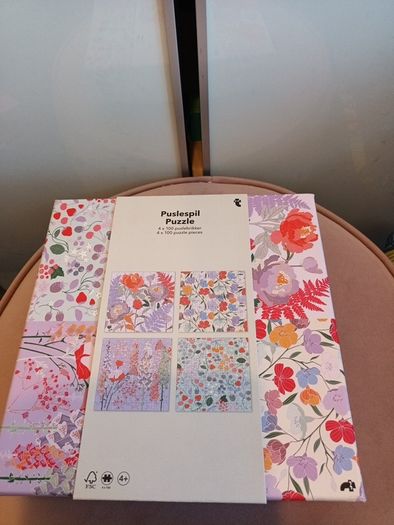 4 jigsaw puzzles on decorative box