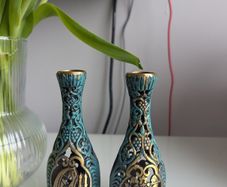 Two candle holders with Jerusalem scene