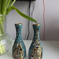 Two candle holders with Jerusalem scene