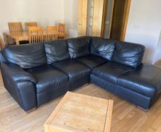 Black leather L shaped couch