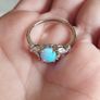 Ring made of 925 silver with oval opal of blue shade and cubic zirconia. Image 3