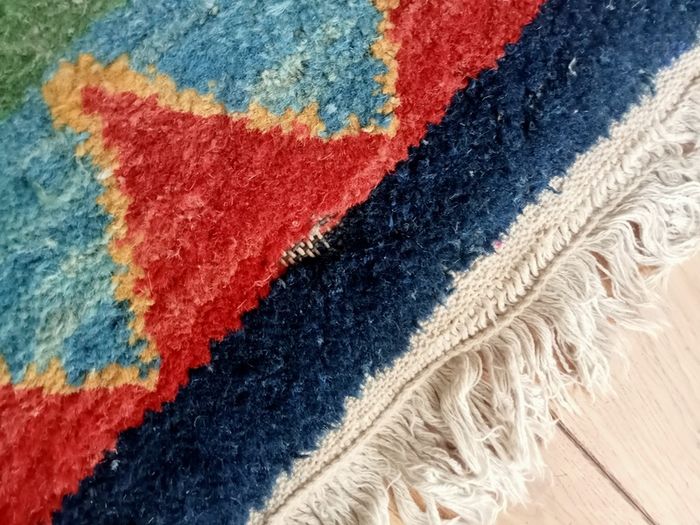 hand-knotted green Gabbeh rug