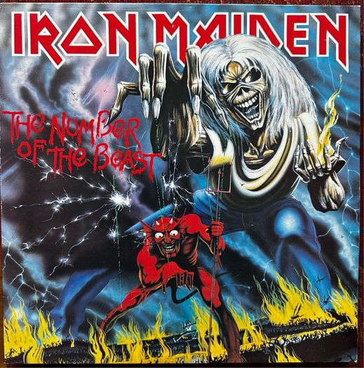Iron Maiden. Irish release The number of the beast. Outer sleeve is vg+ inner sleeve is vg with some small age marks on 1 side. Vinyl is vg with some light wispy scuff marks and writing on 1 label