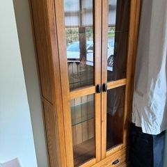 Solid oak display cabinet with glass shelves