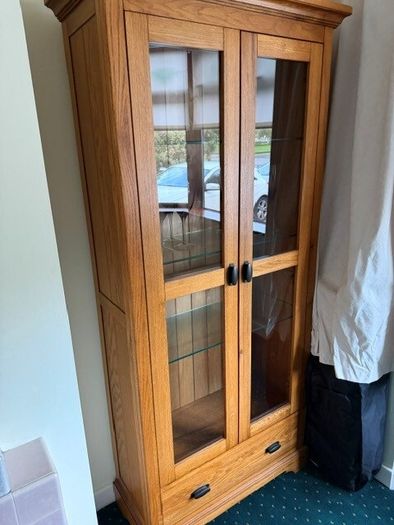 Solid oak display cabinet with glass shelves
