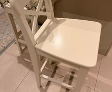 Two wooden bar stools for sale