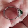 Beautiful silver tone ring with green stone. Image 3