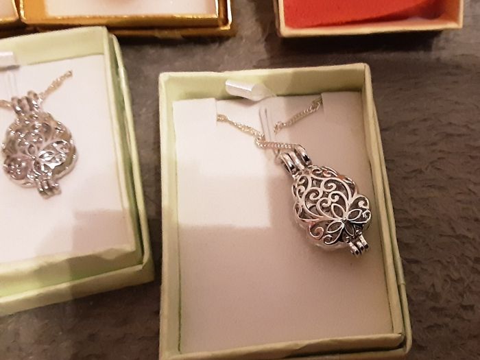 selection of homemade white metal necklaces