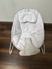 This is a Red Kite Bambino baby bouncer in a grey elephant design