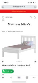 White wooden single bed low foot end