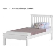 White wooden single bed low foot end